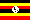 Lugandsk periodick tabulka pod vlajkou Ugandy, kde je jednm z oficilnch jazyk (hl. ve stt Buganda)
